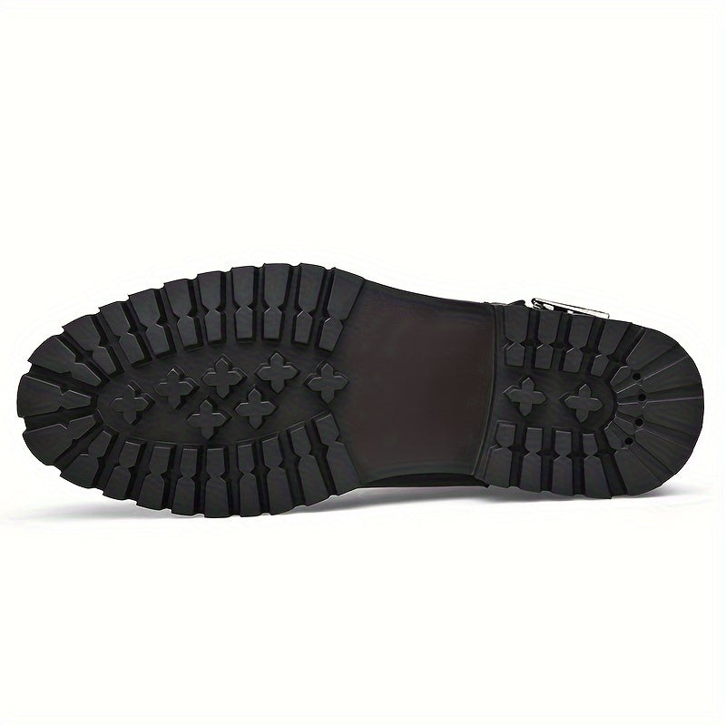 Men's black leather boots, close-up of treaded rubber sole