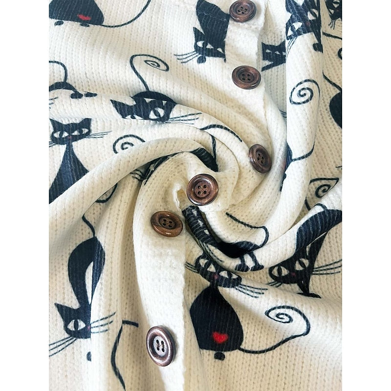 Close-up of floral-motif knit fabric and button detail on a women's cardigan