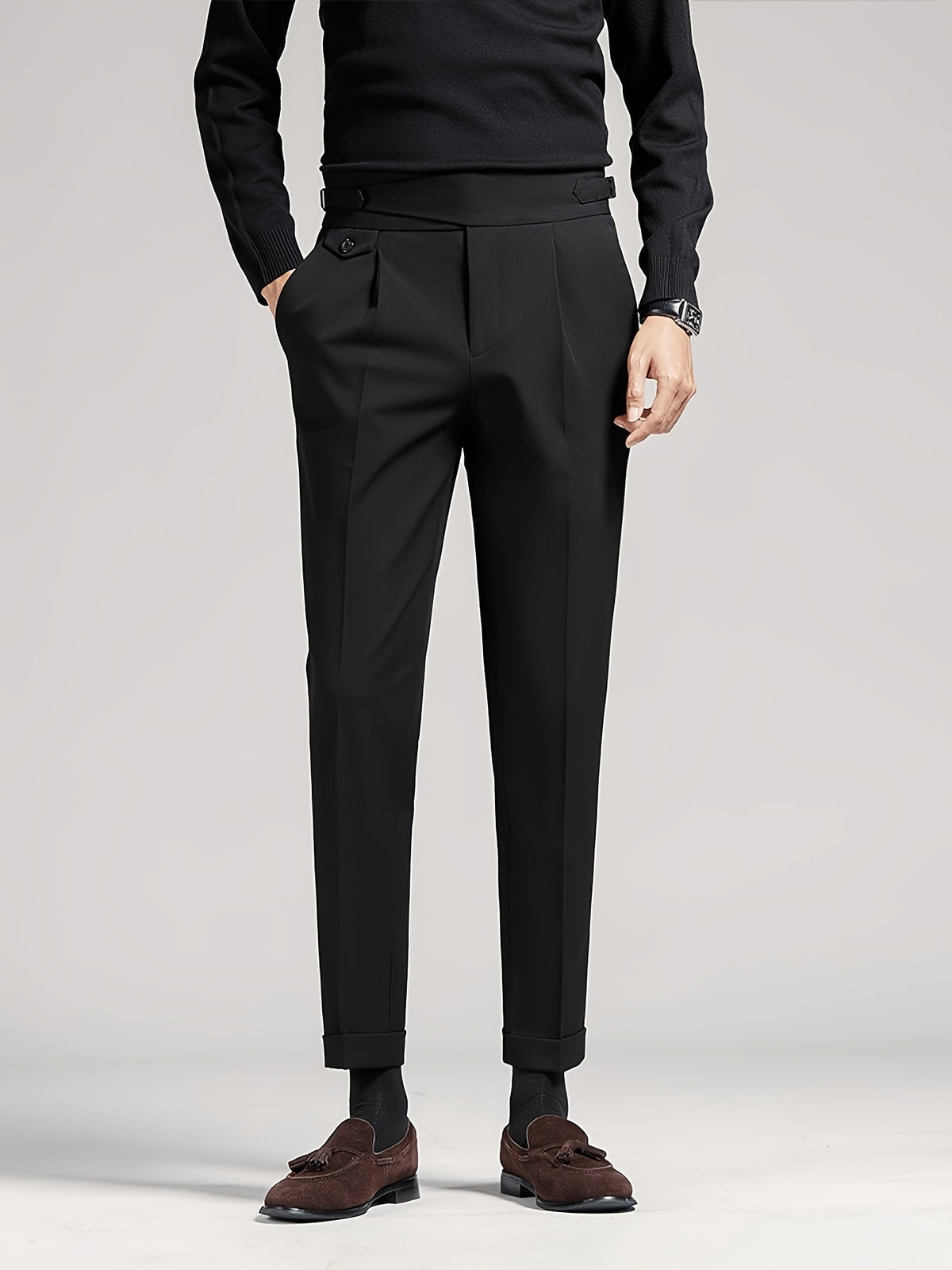 Men's black tailored pleated high-waist trousers, front view