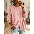 Women's pink knit cardigan with a soft, button-front closure