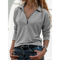 Women's gray collared quarter-zip top with an adjustable neckline