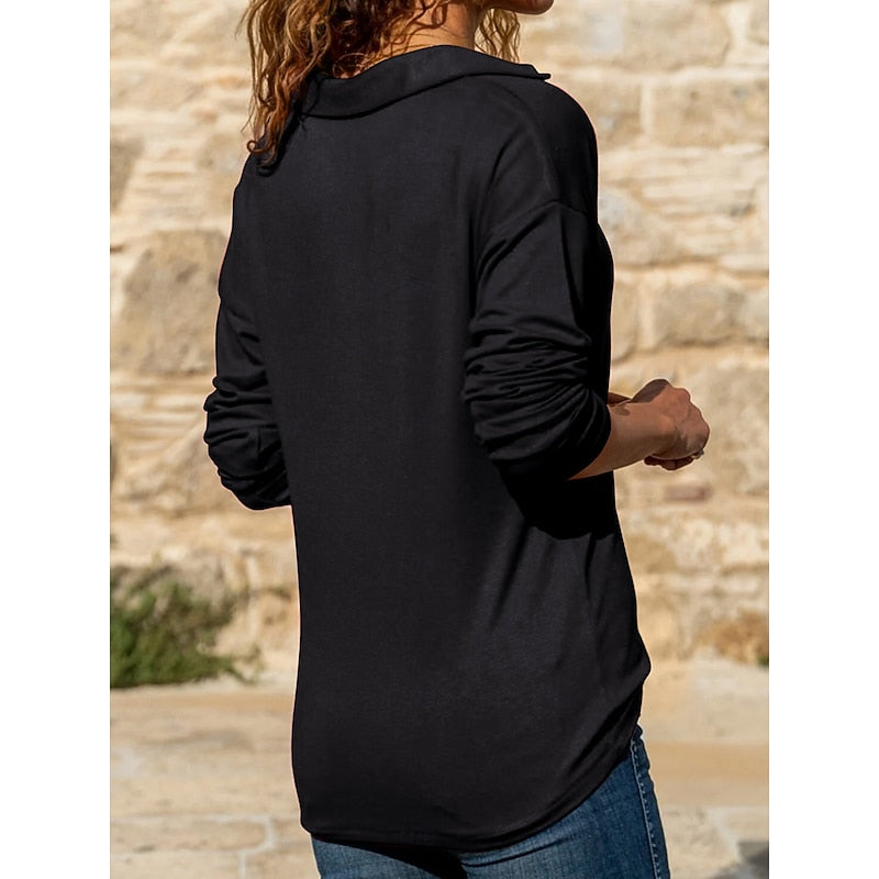 Women's black collared quarter-zip top with an adjustable neckline