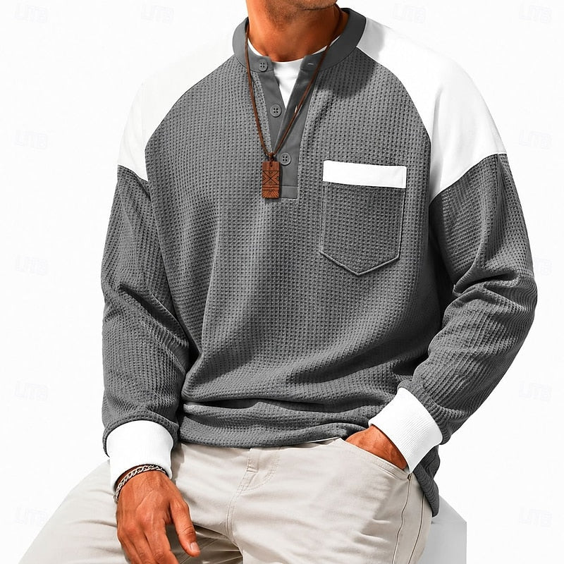 Men's light blue henley shirt, close-up of collar and buttons