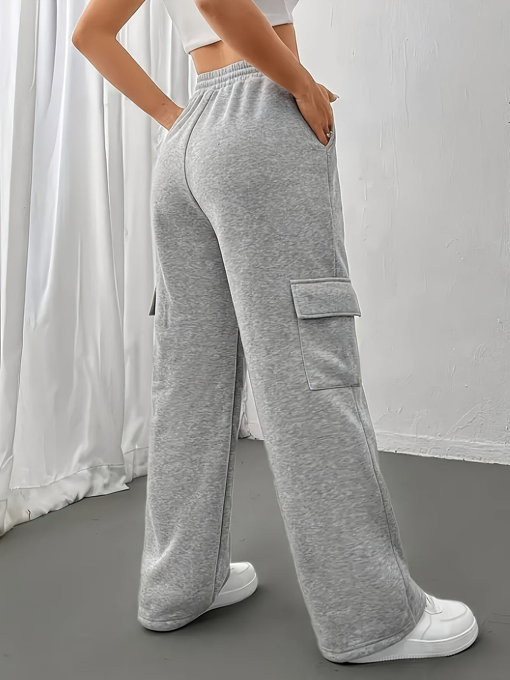 Women's grey cargo joggers, back view with wide-leg silhouette