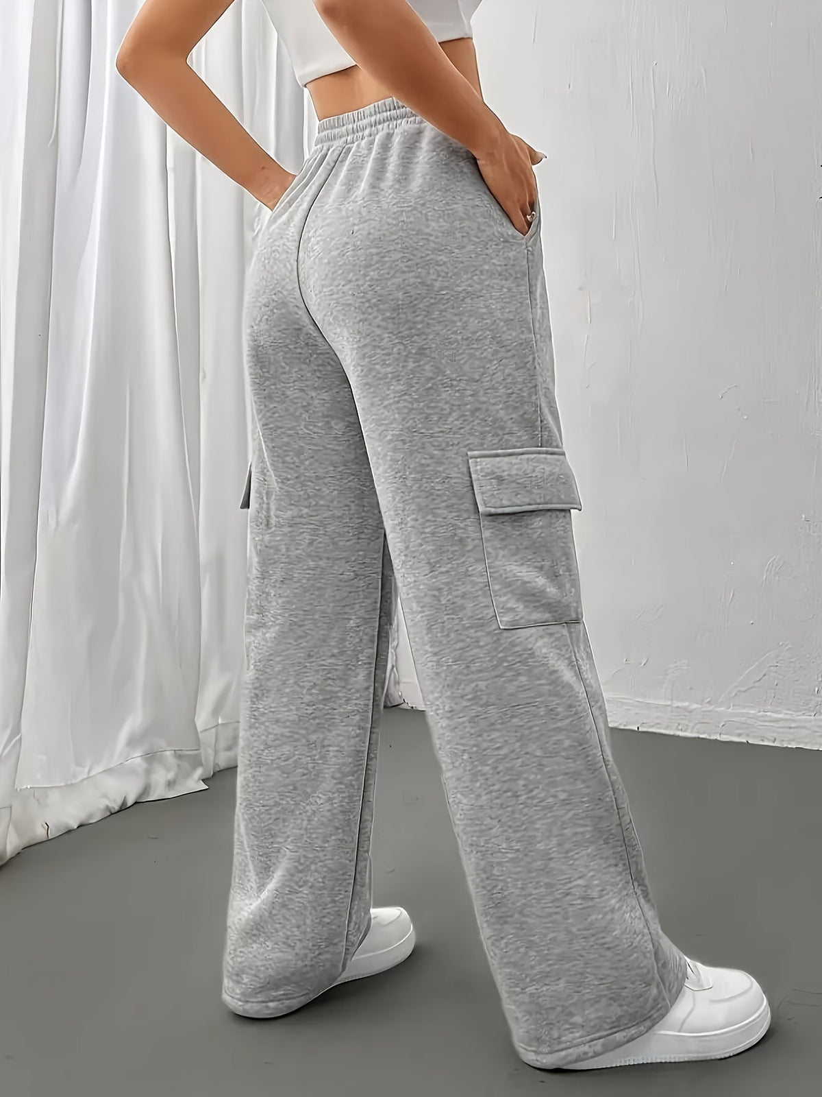 Women's grey cargo joggers, back view with wide-leg silhouette