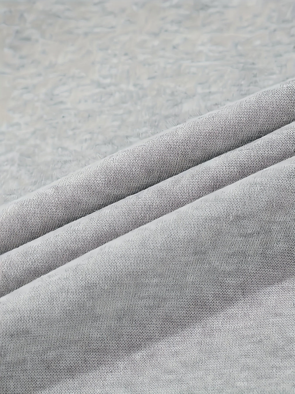 Women's grey cargo joggers, close-up of fleece knit fabric