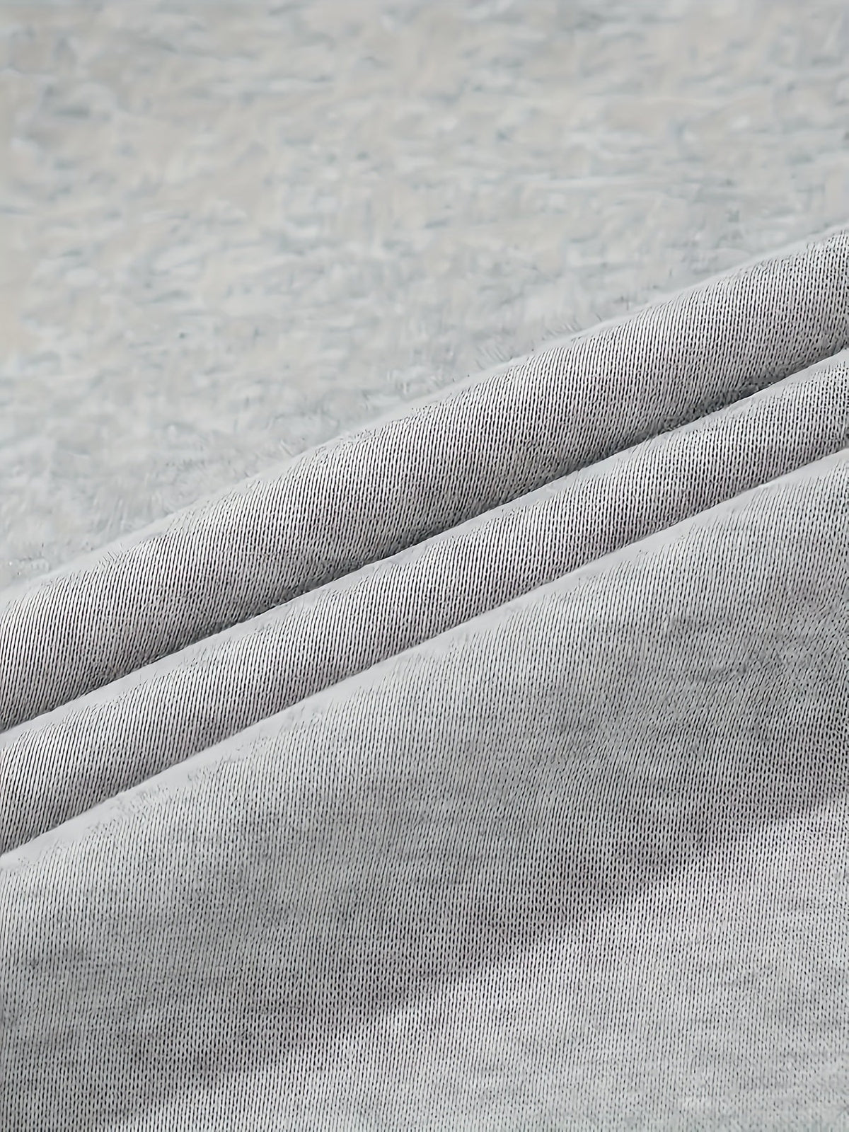 Women's grey cargo joggers, close-up of fleece knit fabric