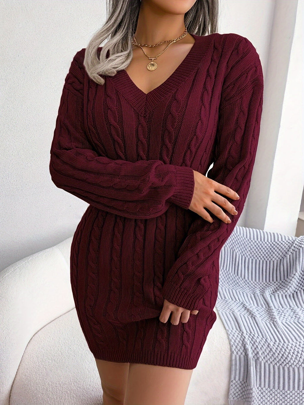 Women's burgundy cable knit peplum sweater dress, front view