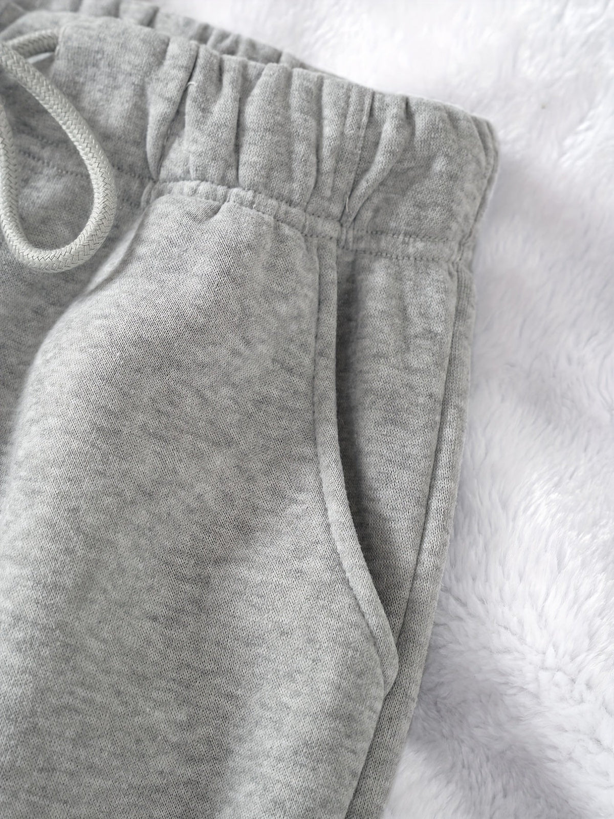 Women's light grey relaxed drawstring joggers with cuffed ankles