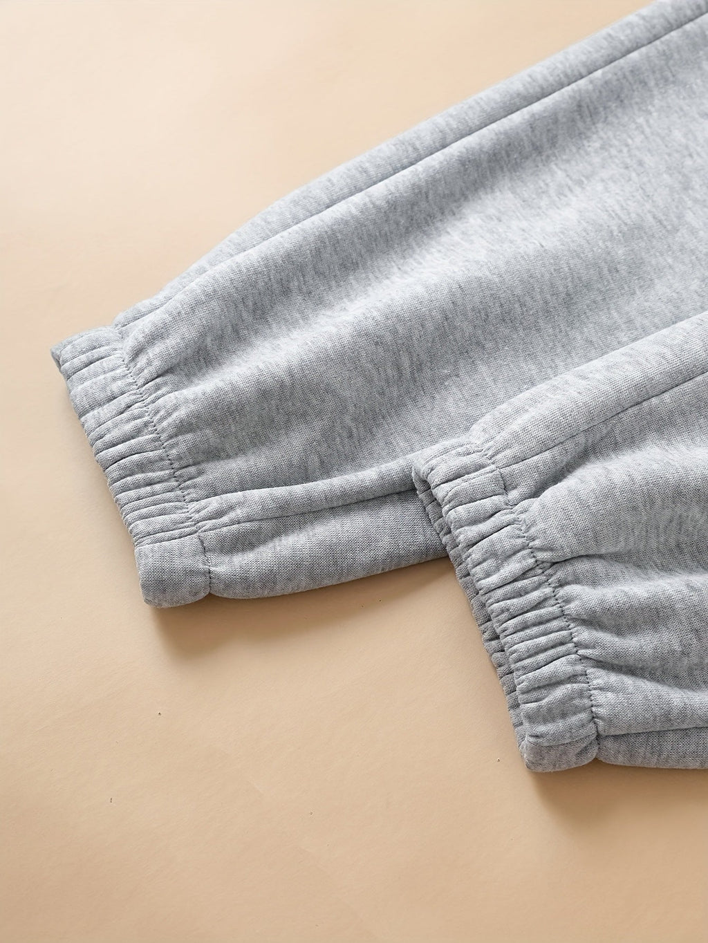 Women's light grey relaxed drawstring joggers with cuffed ankles