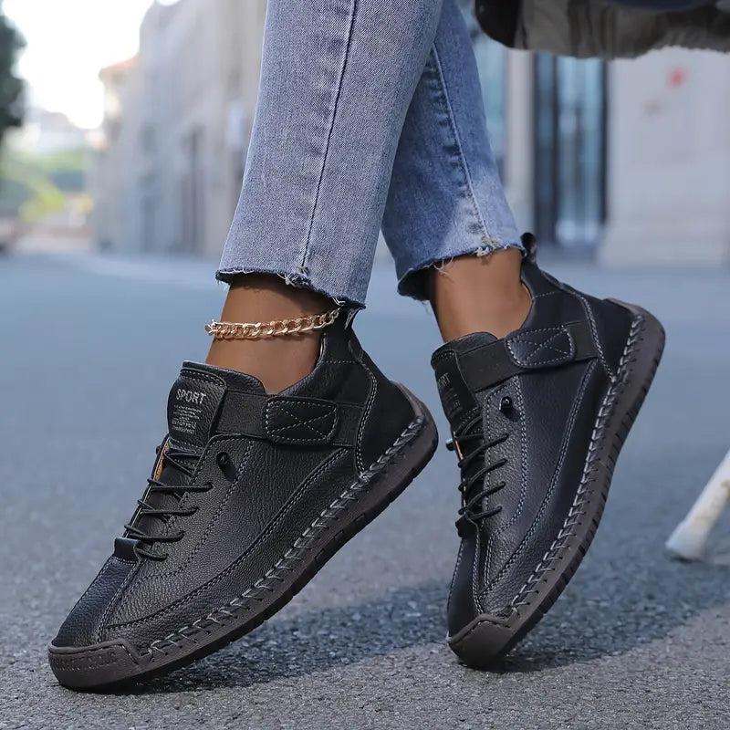 Women's black lace-up casual sneakers with a cushioned sole