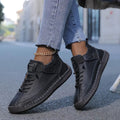 Women's black lace-up casual sneakers with a cushioned sole