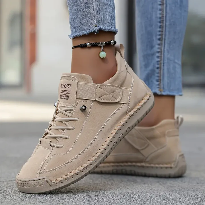 Women's white lace-up casual sneakers with a cushioned sole
