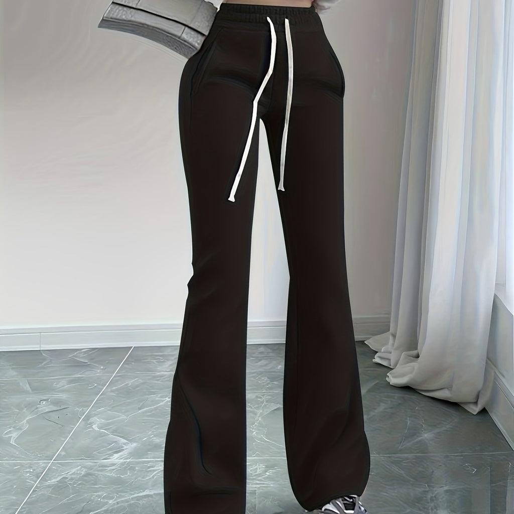 Women's black high-waisted flared lounge pants, back detail view