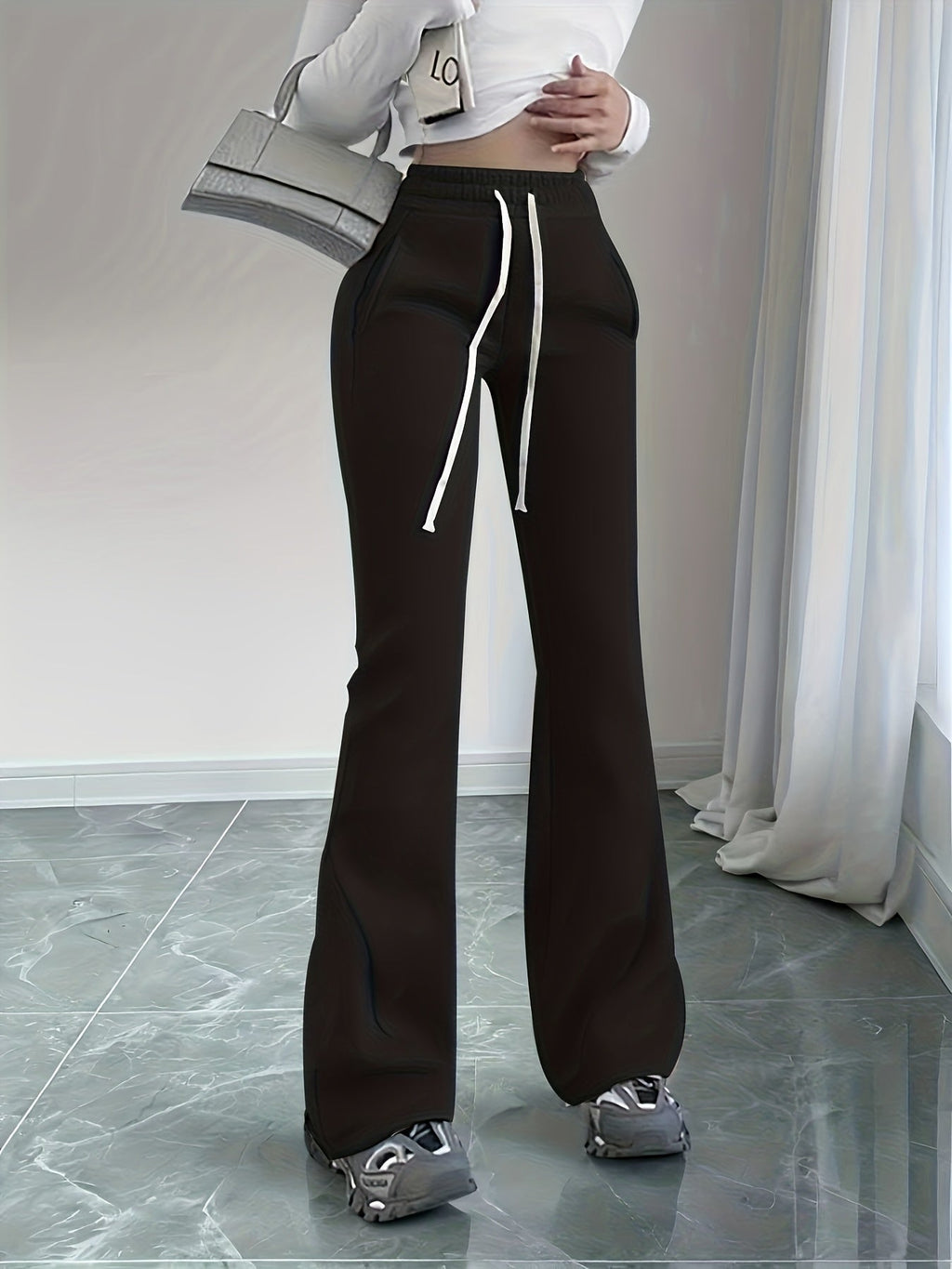 Women's black flared lounge pants with adjustable drawstring waist