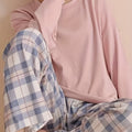 Women's pink two-piece plaid pajama set with long sleeves for fall