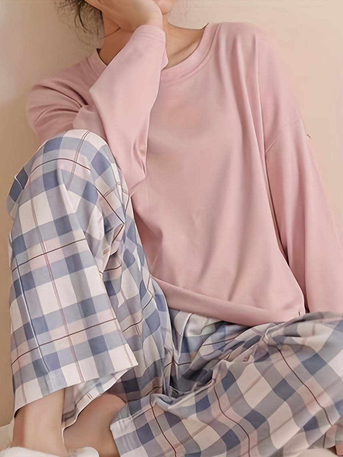 Women's pink two-piece plaid pajama set with long sleeves for fall