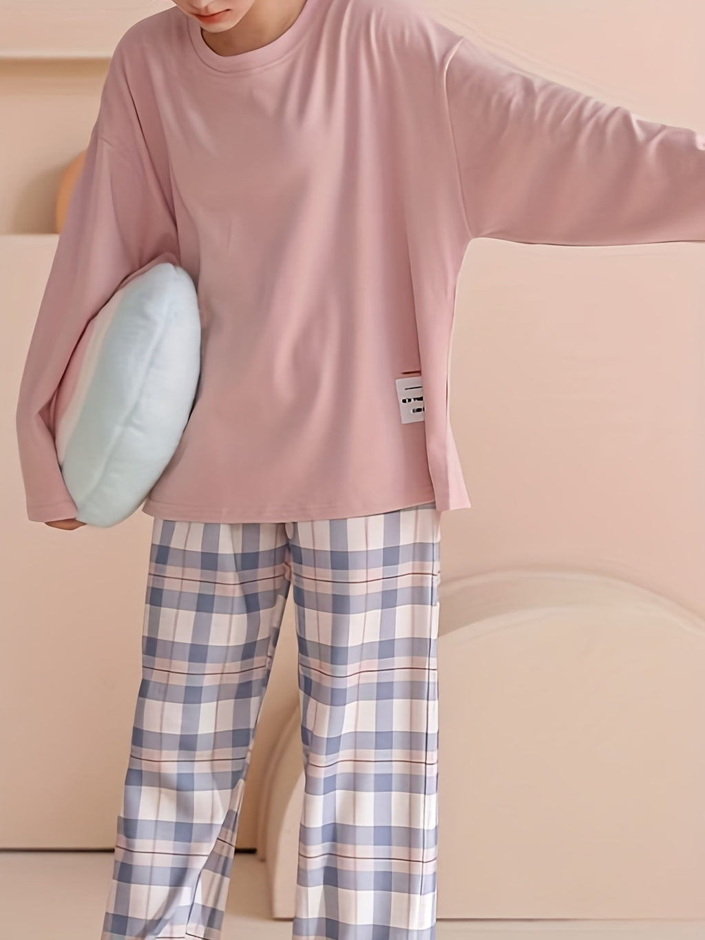 Women's pink two-piece plaid pajama set with long sleeves for fall