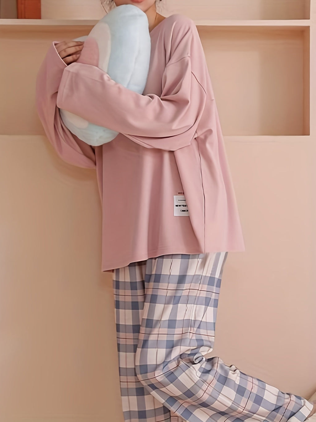 Women's pink two-piece plaid pajama set with long sleeves for fall
