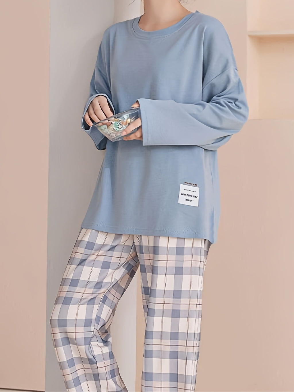 Women's pink two-piece plaid pajama set with long sleeves for fall