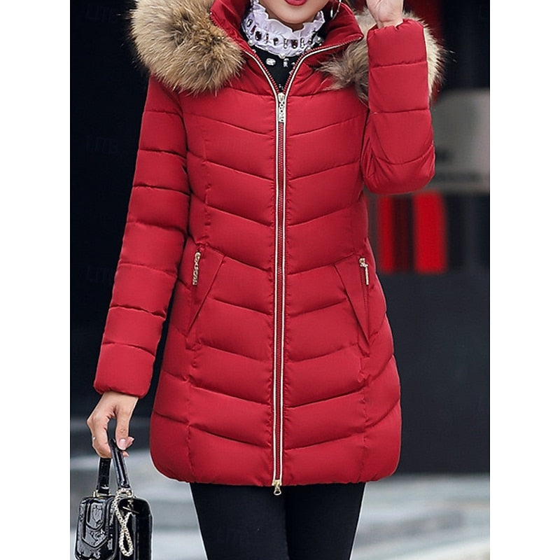 Women's hooded quilted puffer jacket with a zip-up front and soft hood