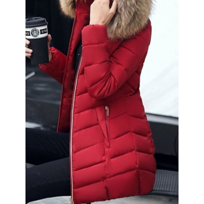 Women's hooded quilted puffer jacket with a zip-up front and soft hood