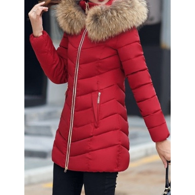 Women's hooded quilted puffer jacket with a zip-up front and soft hood