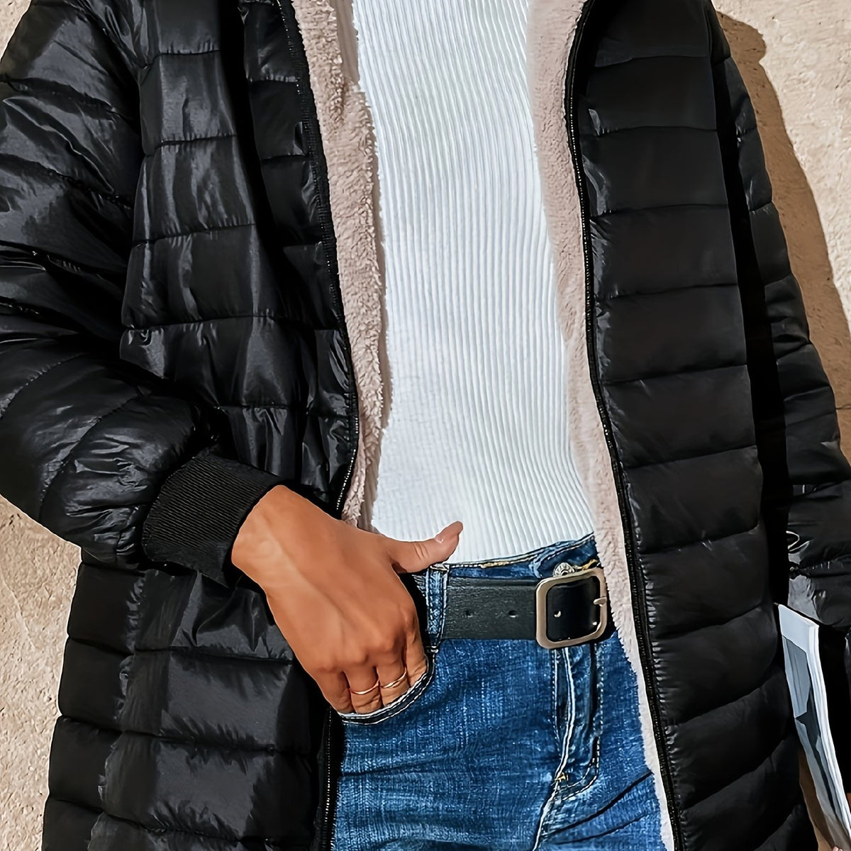 Women's quilted longline coat with a full zip and ribbed cuffs