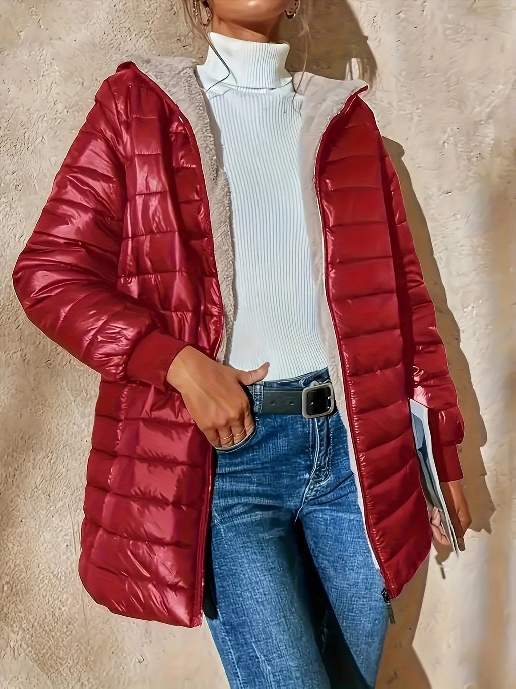 Women's quilted longline coat with a full zip and ribbed cuffs
