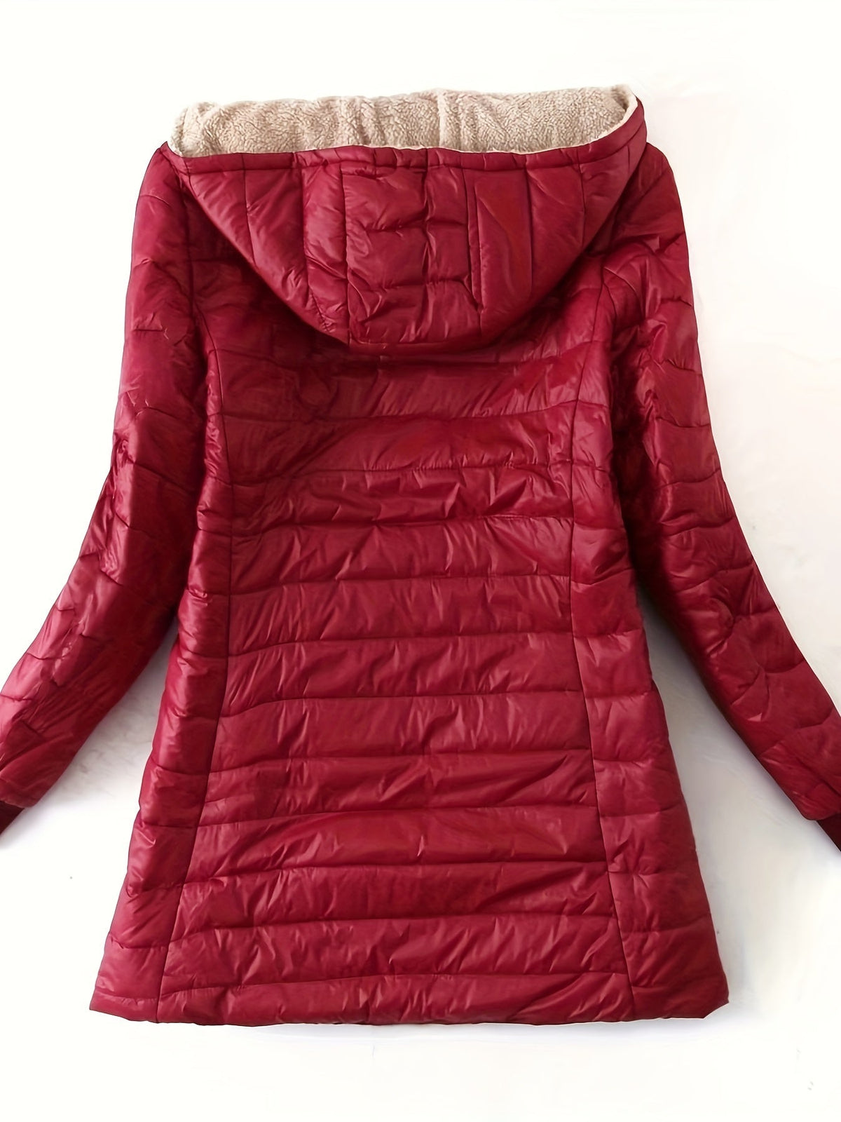 Women's quilted longline coat with a full zip and ribbed cuffs