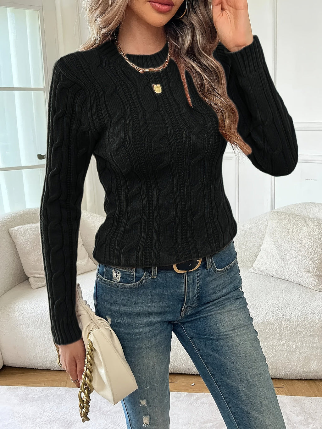Women's black cable knit crew neck sweater with long sleeves