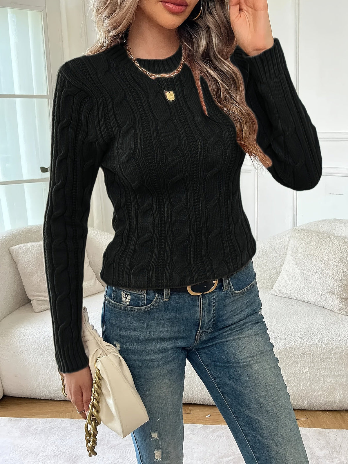 Women's black cable knit crew neck sweater with long sleeves