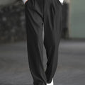Men's black wide-leg dress trousers with a tailored, relaxed fit