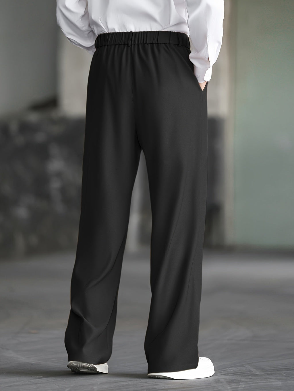 Men's black wide-leg dress trousers with a tailored, relaxed fit