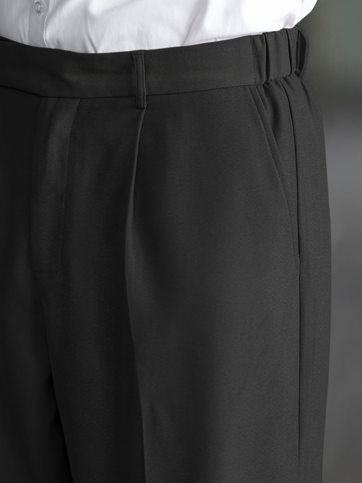 Men's black wide-leg dress trousers with a tailored, relaxed fit