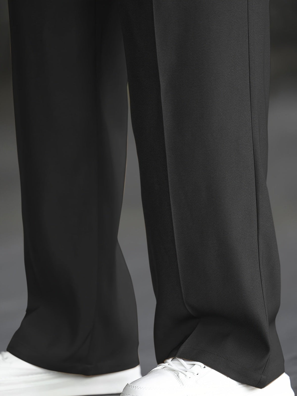 Men's black wide-leg dress trousers with a tailored, relaxed fit