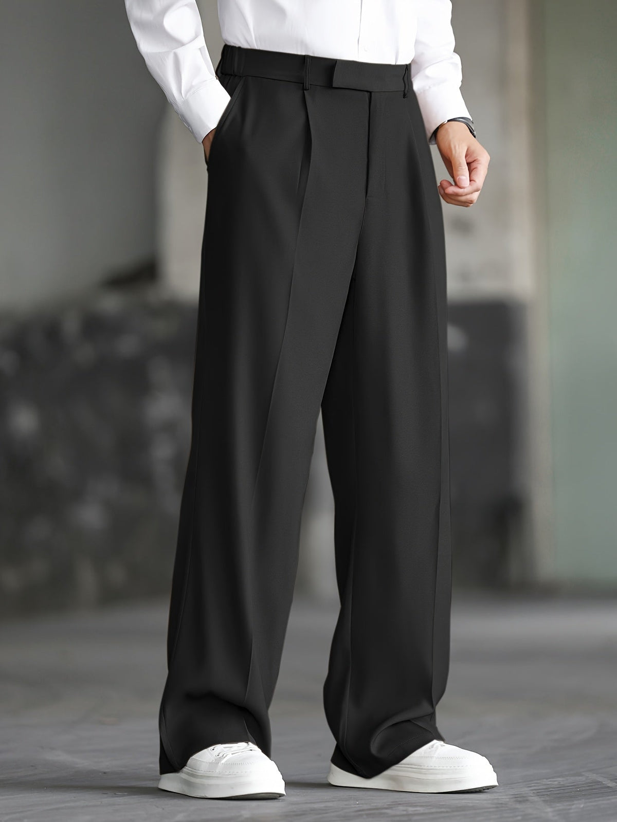 Men's black wide-leg dress trousers with a tailored, relaxed fit