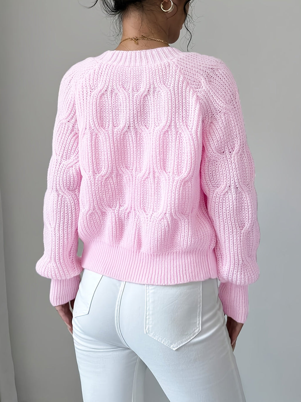 Women's pink long sleeve knit cardigan, back view