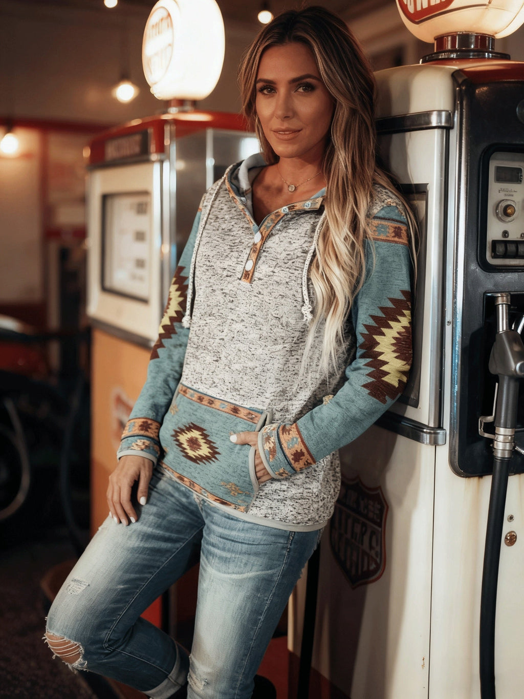 Women's grey and green western hooded sweatshirt, styled outdoors