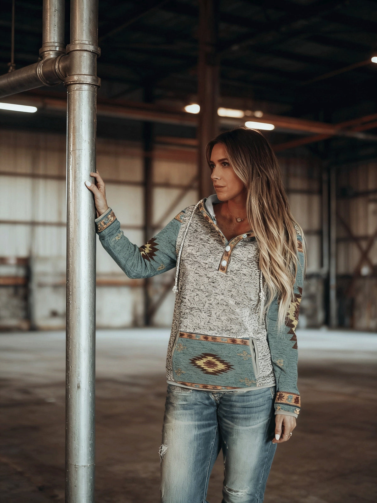 Women's grey and green western hooded sweatshirt, indoor pose