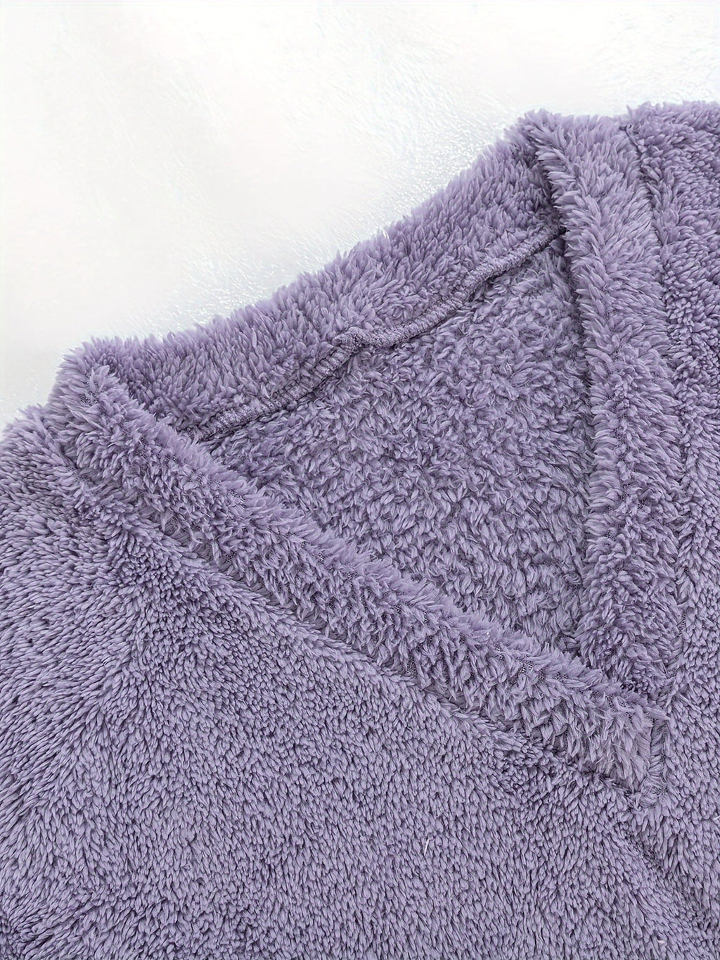 Women's purple fleece loungewear set, close-up of the V-neckline