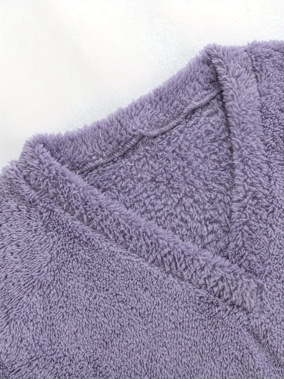 Women's purple fleece loungewear set, close-up of the V-neckline