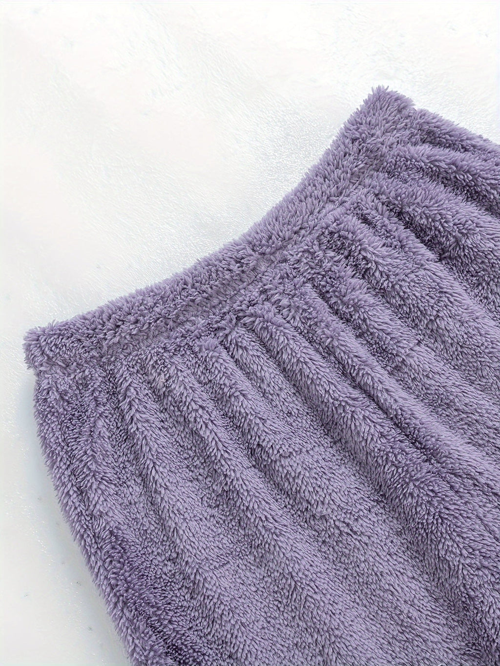 Women's purple fleece loungewear set, close-up of the ribbed hem