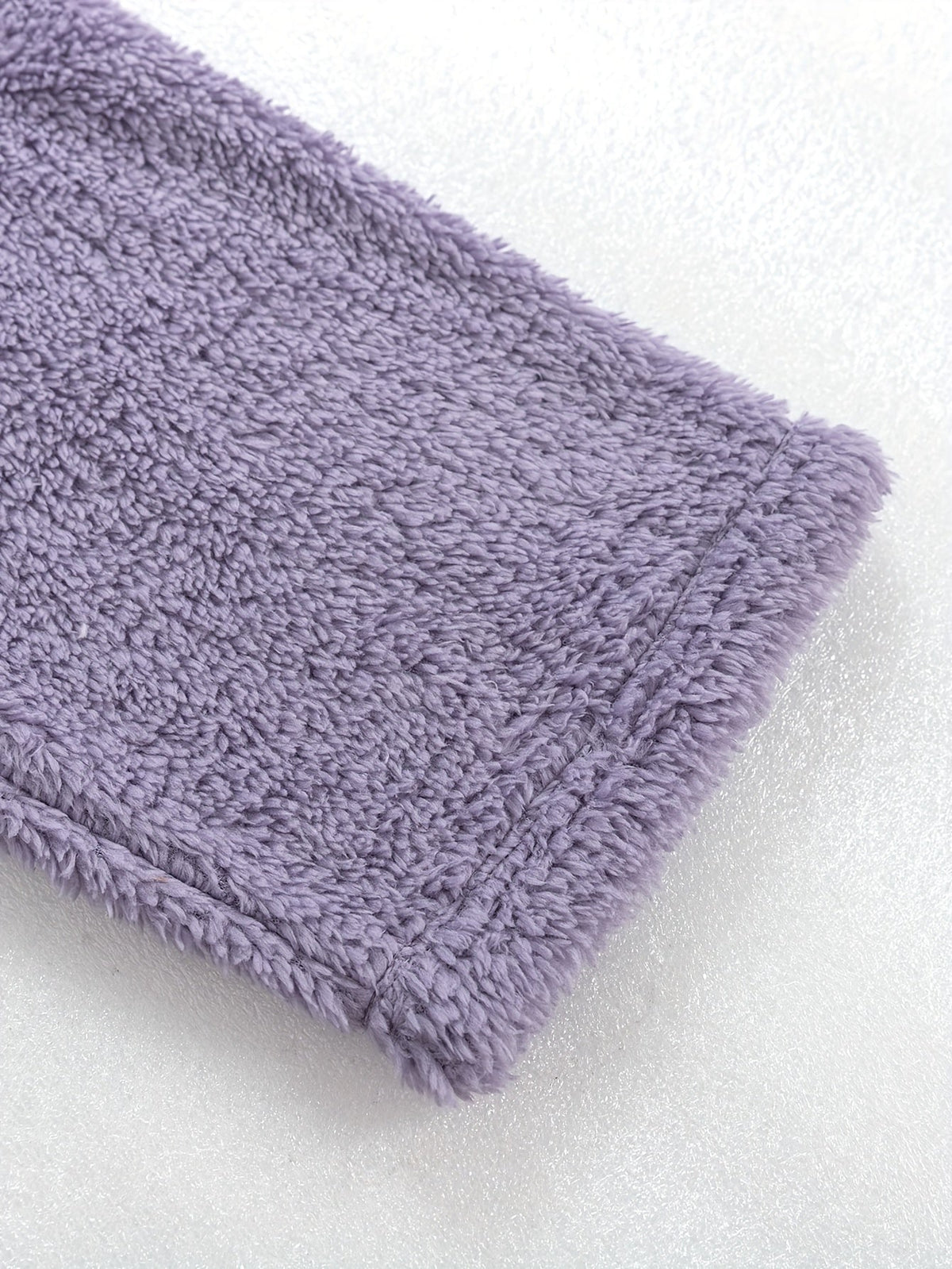 Women's purple fleece loungewear set, close-up of the ribbed hem