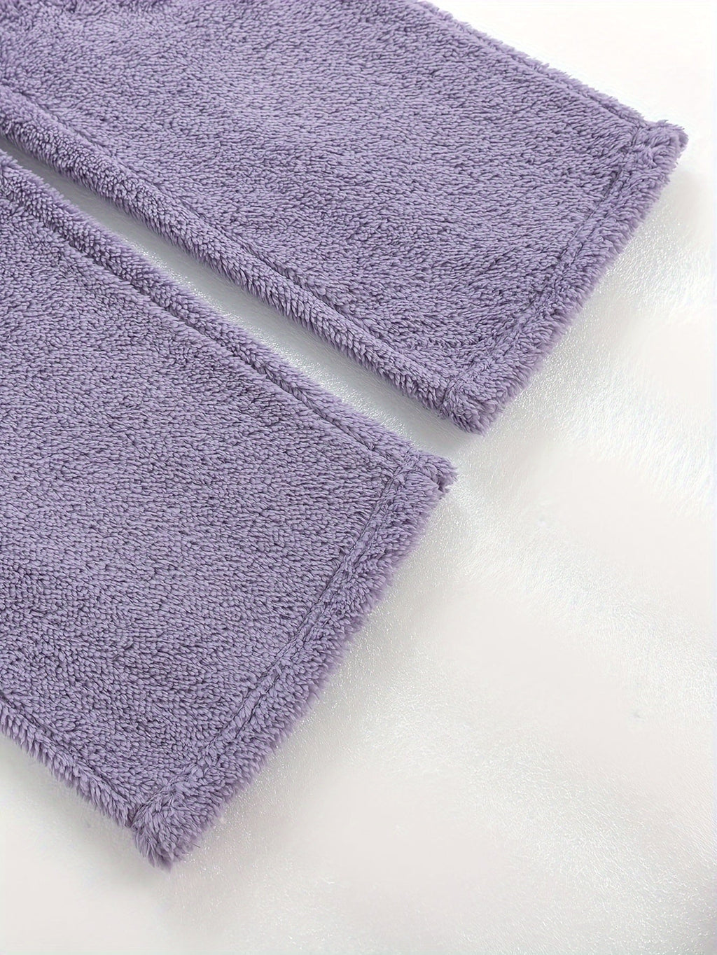 Women's purple fleece loungewear set, close-up of the ribbed hem