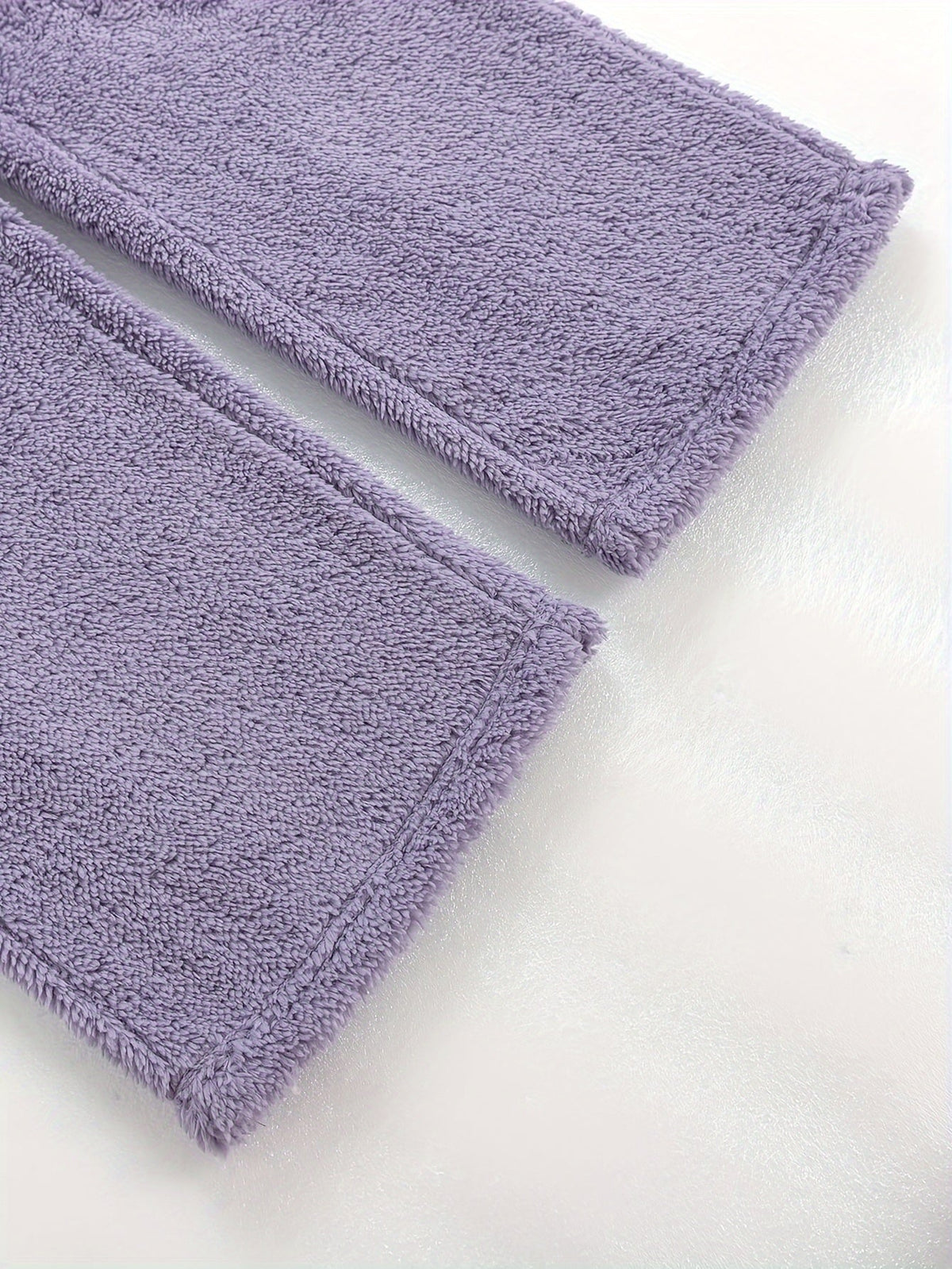Women's purple fleece loungewear set, close-up of the ribbed hem