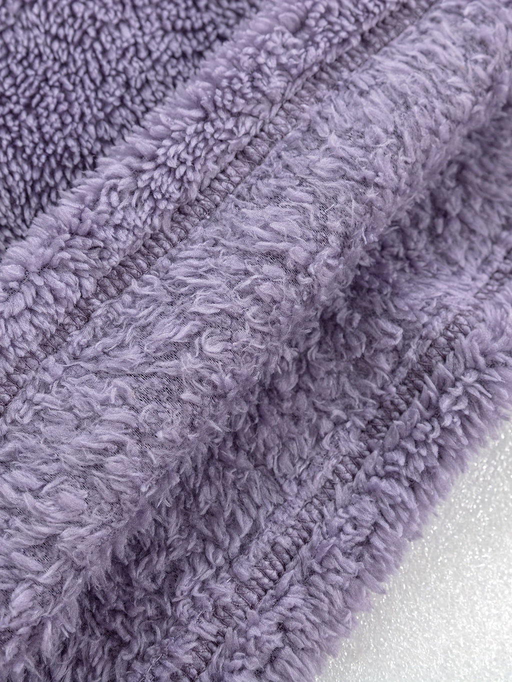Women's purple fleece loungewear set, close-up of the ribbed hem