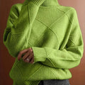 Women's textured knit turtleneck sweater with a relaxed, roomy fit