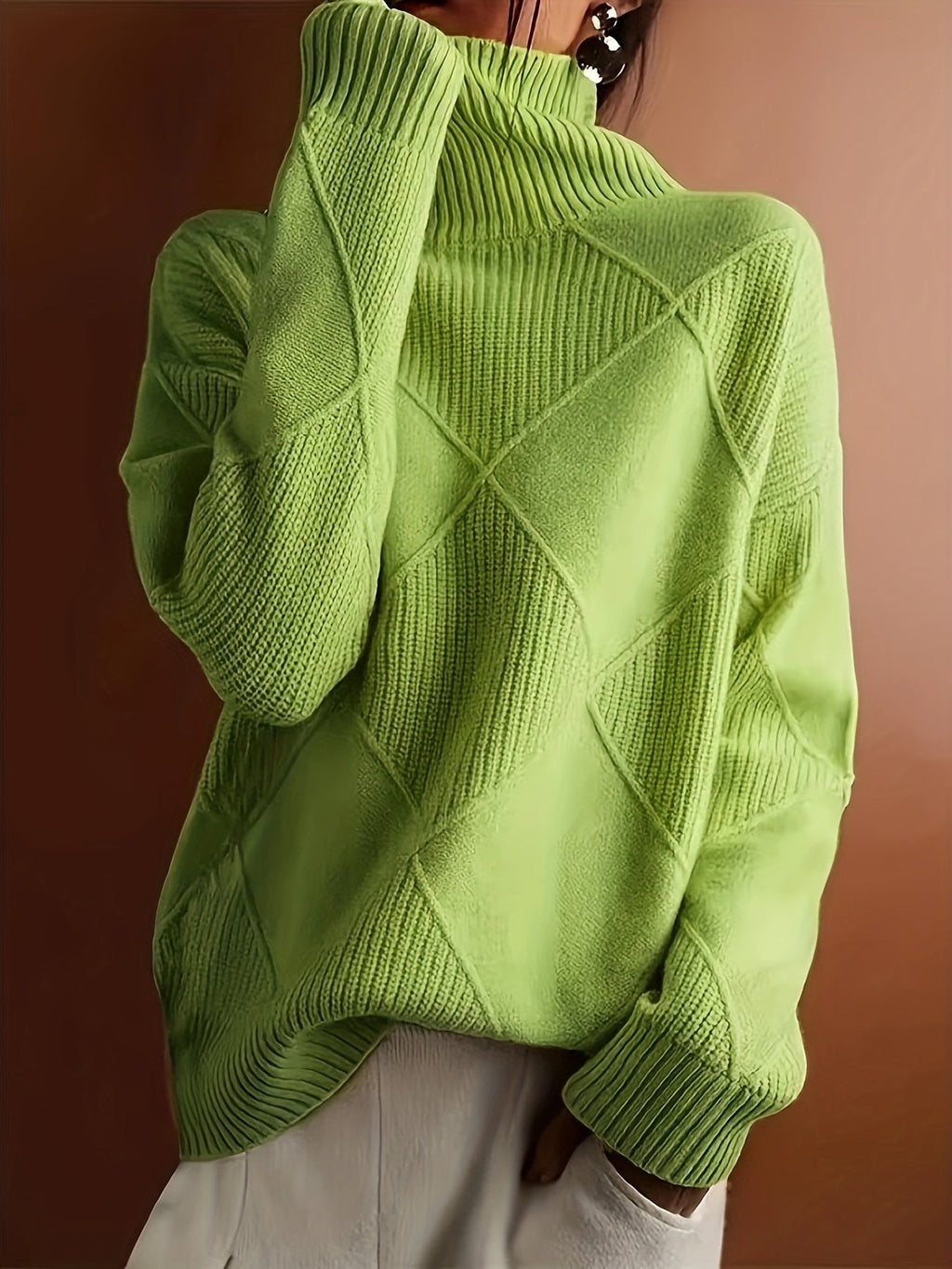 Women's textured knit turtleneck sweater with a relaxed, roomy fit
