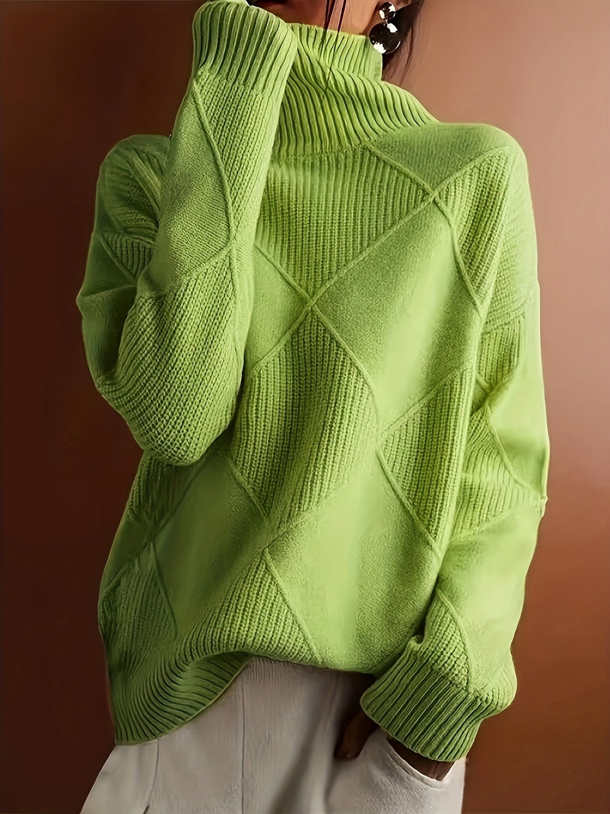Women's textured knit turtleneck sweater with a relaxed, roomy fit